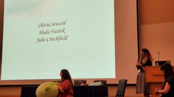 Olivia Seward receiving her prize for best poster.