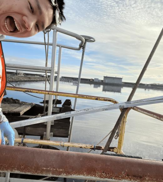 Delbert making a fun face in front of water.